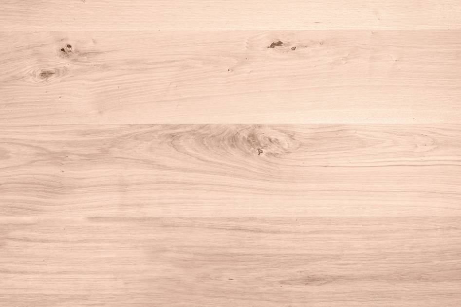 Hand applying natural preservative on timber